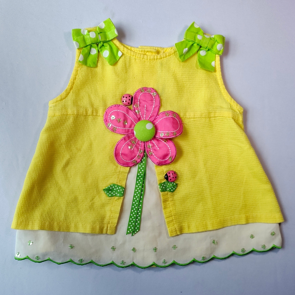 Yellow Dress with Pink Flower and Green Accents